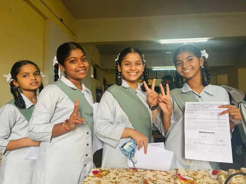 Students smiling after participating in an HPV vaccination drive